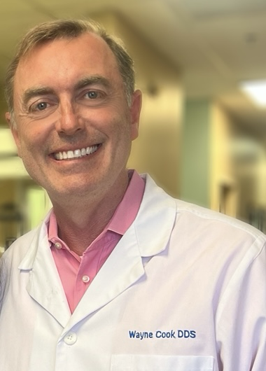 Dr. Wayne Cook in white coat